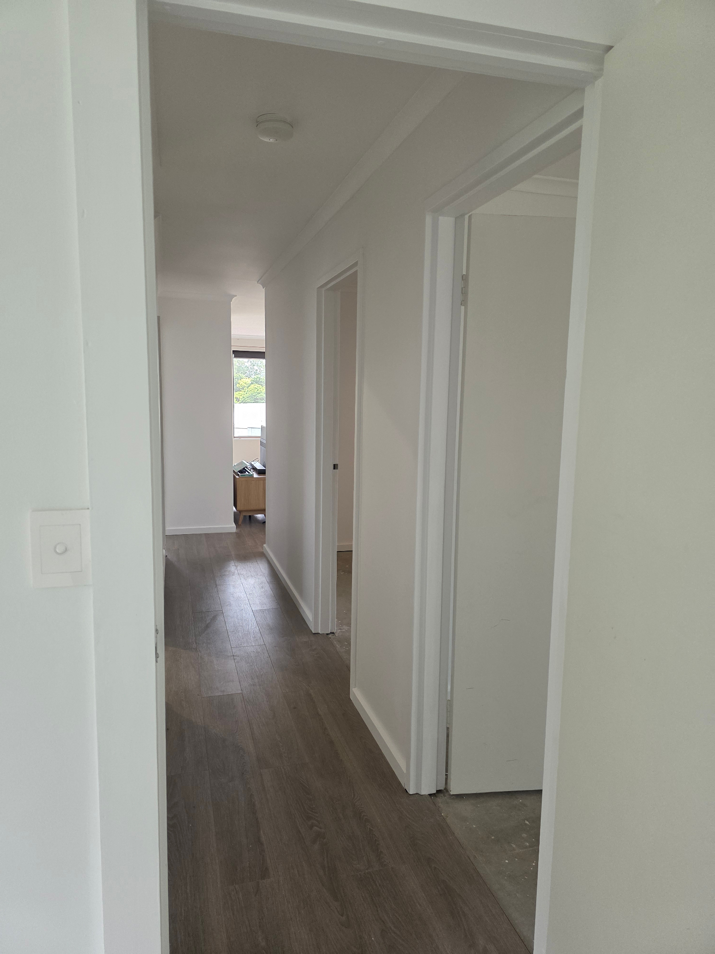 Bright white interior hallway repaint with clean trim lines